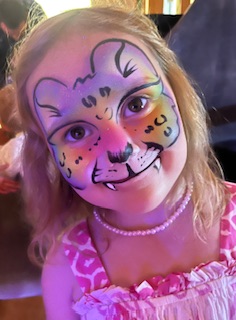 girl with rainbow leopard face painting in Shrewsbury